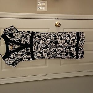 White House Black Market dress. Black and white floral print with black trim.